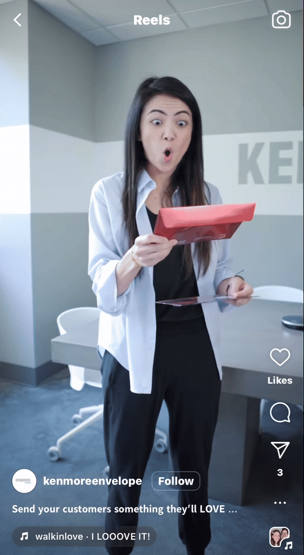 Gif of two people handing back and forth envelopes and saying "I love it!"