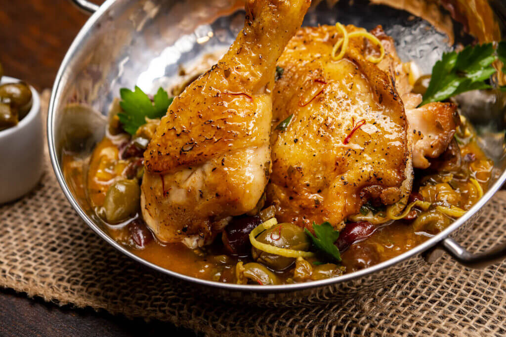 Image of chicken and seasoning in a bowl